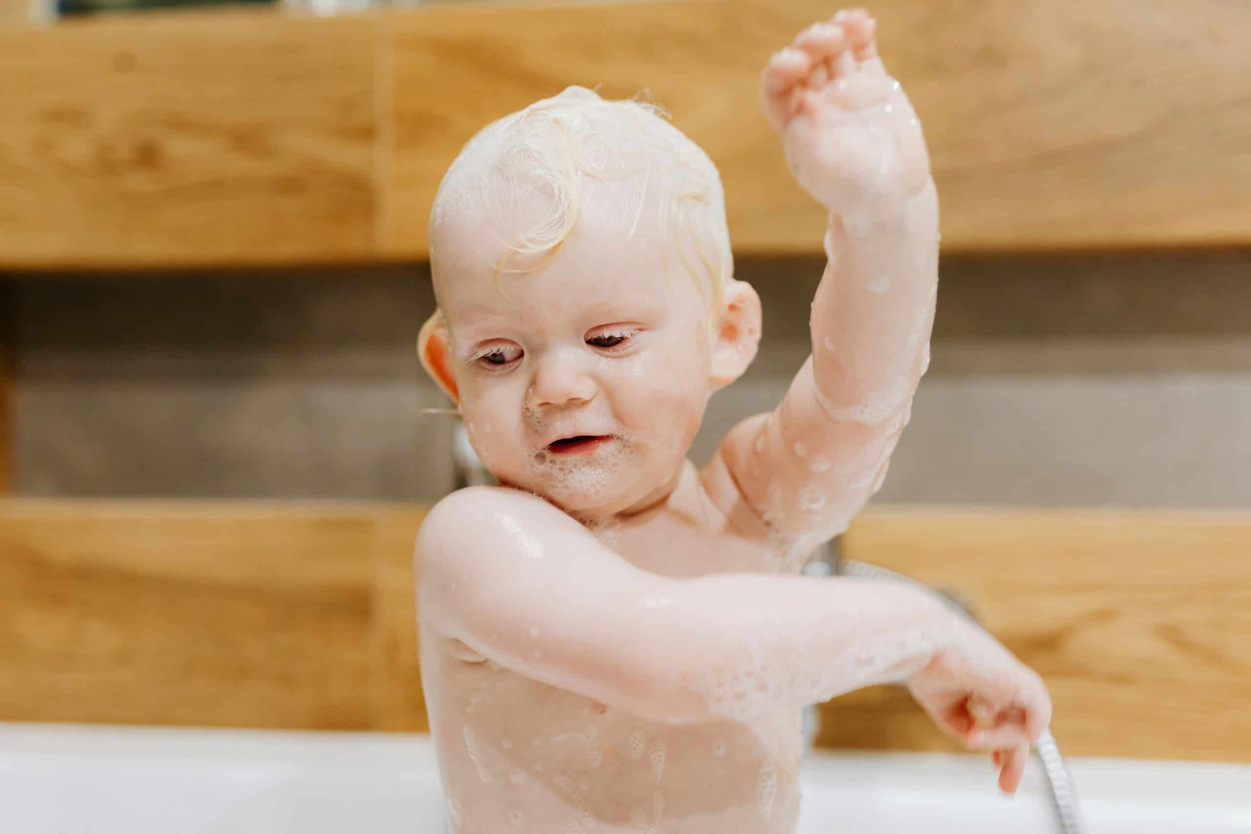 Baby Boy Enjoying In Bathroom While Taking Bath