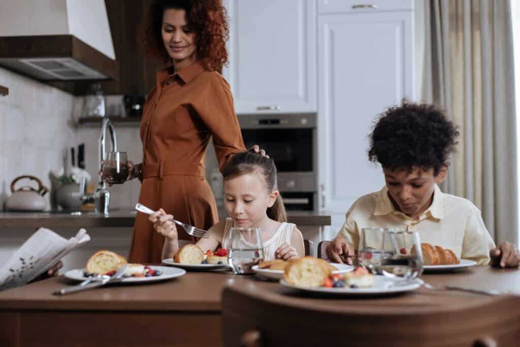 Mom In Kitchen With Two Kids