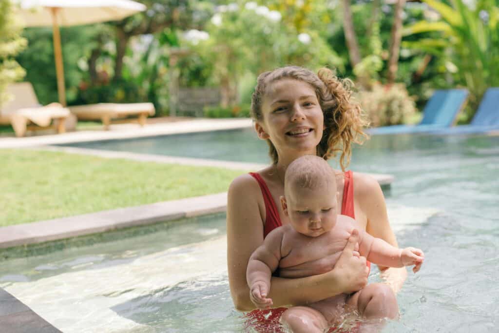 Mom With Baby In Pool