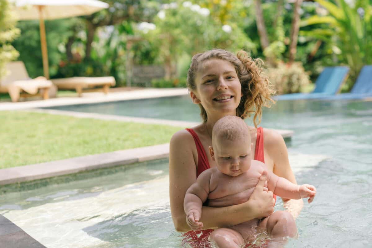 Mom With Baby In Pool